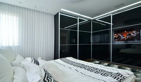 Дизайн углового шкафа в спальне