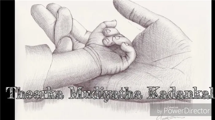 Baby hand in fathers hands draw